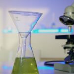 a funnel on an erlenmeyer flask